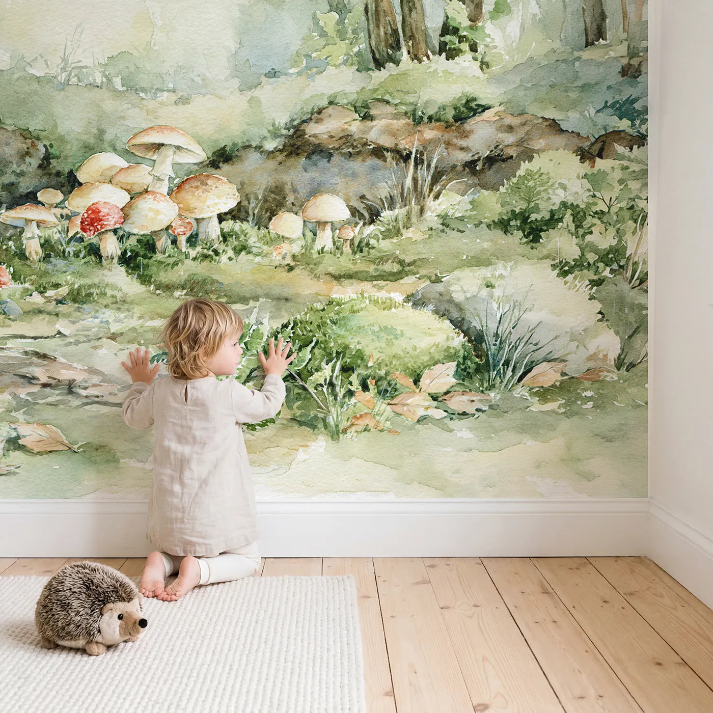 Child in nursery with Mushroom Forest Floor Wallpaper Mural by Whimsy Tots