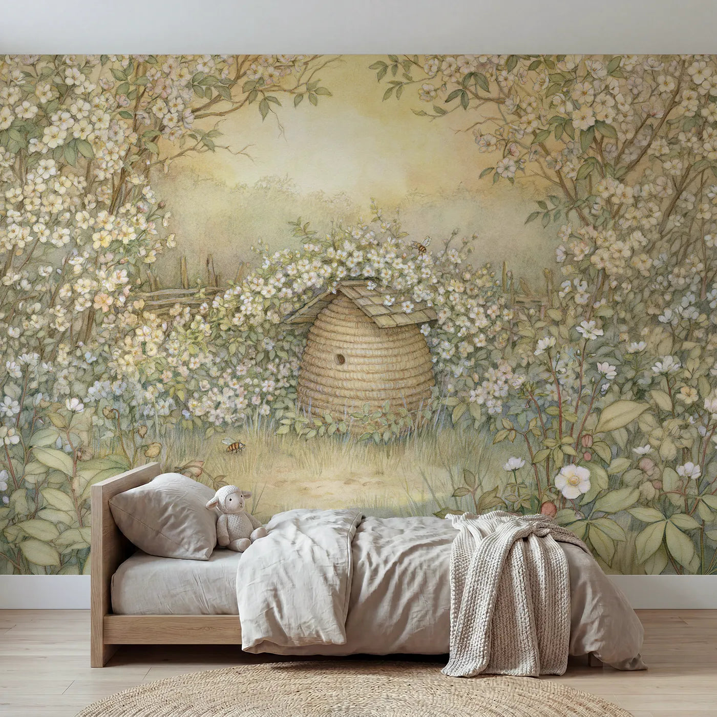 Storybook wall mural of a little coiled beehive on soft blush by Whimsy Tots