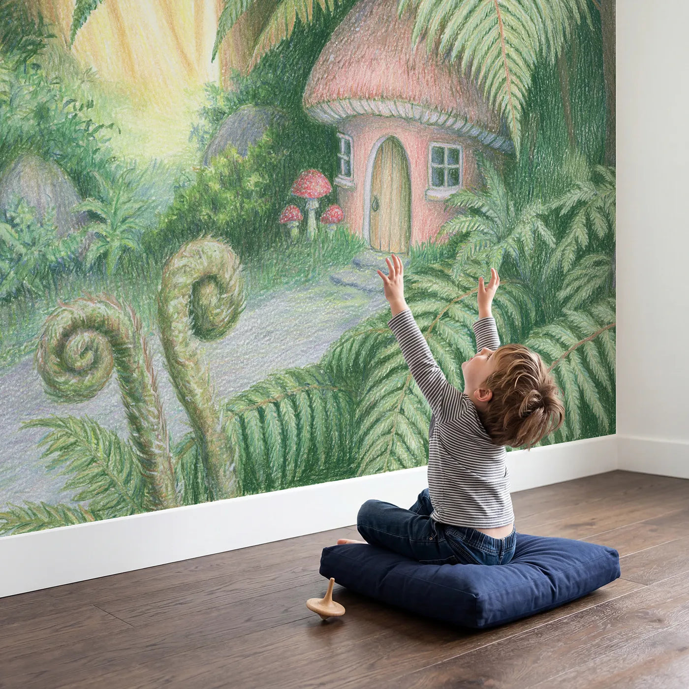 Child in nursery with Mushroom House Under Ferns Wallpaper Mural by Whimsy Tots