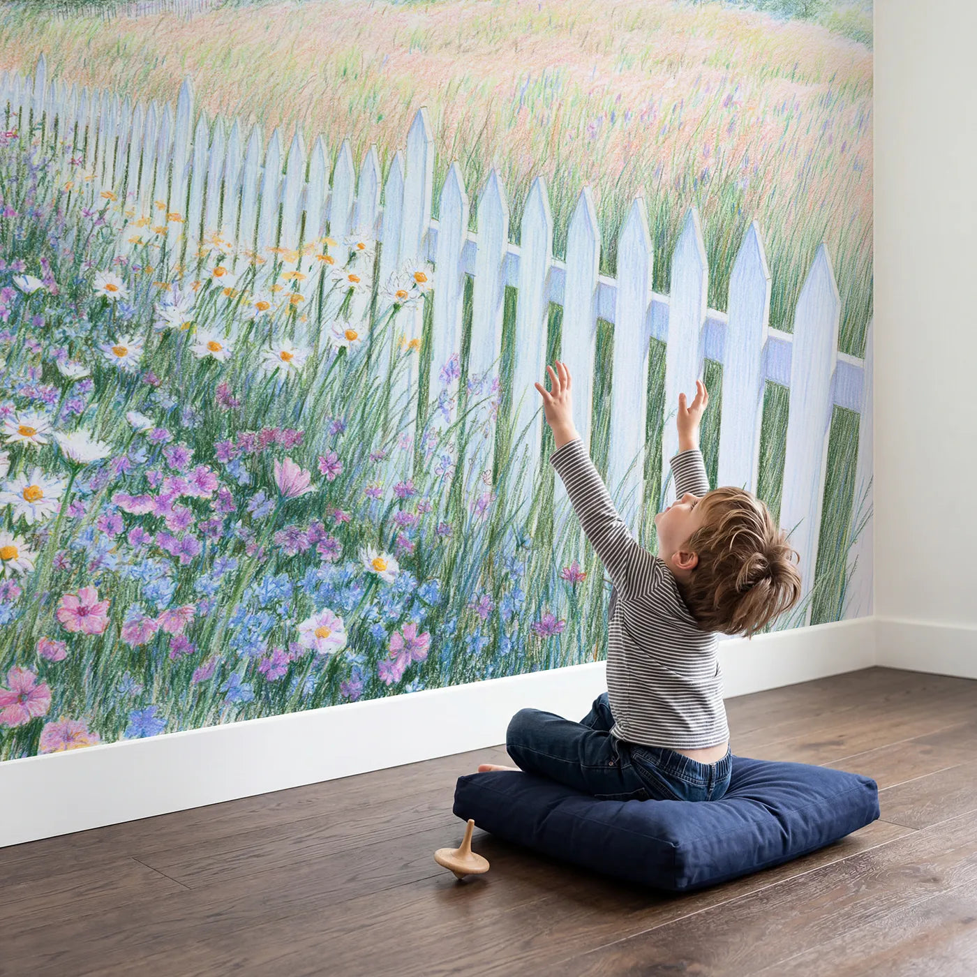 Child in nursery with Picket Fence Meadow Wallpaper Mural by Whimsy Tots