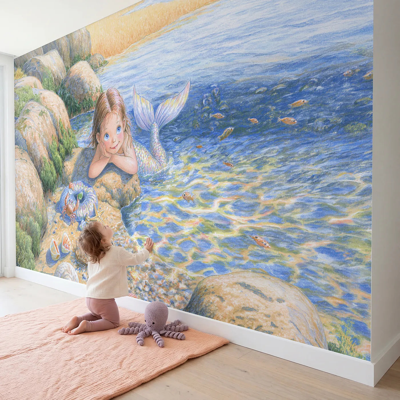 Child in nursery with Mermaid Tide Pool Day Wallpaper Mural by Whimsy Tots