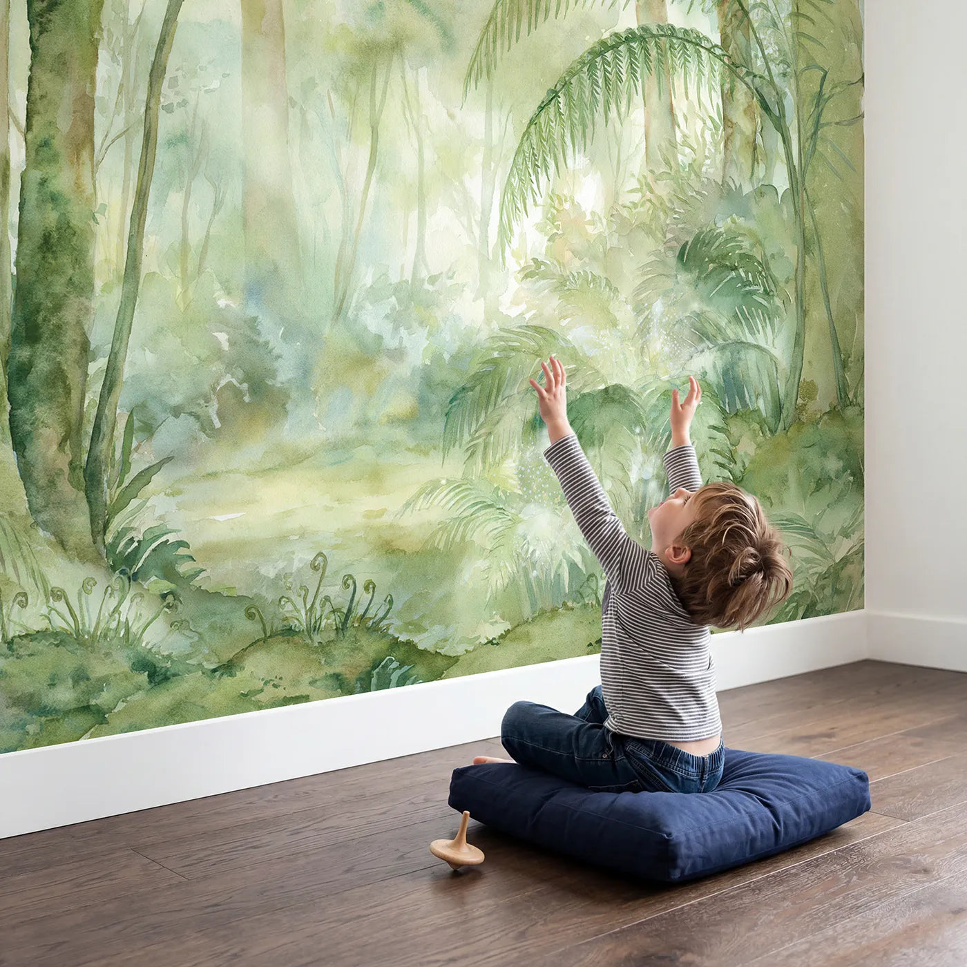 Child in nursery with Misty Fairy Glen Wallpaper Mural by Whimsy Tots