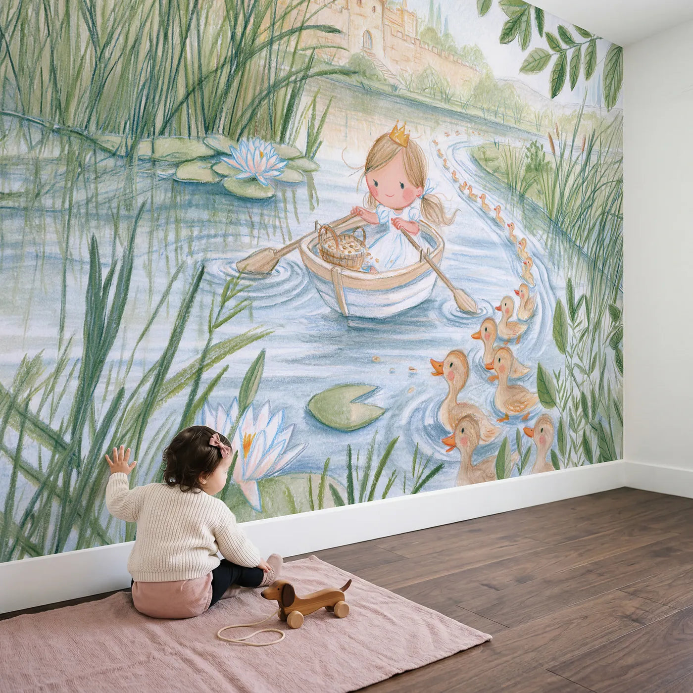 Child in nursery with Princess Moat Boat Wallpaper Mural by Whimsy Tots