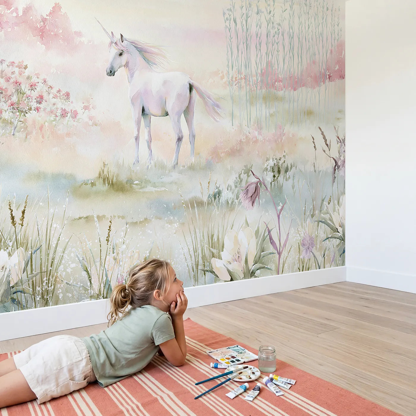 Child in nursery with Misty Unicorn Meadow Wallpaper Mural by Whimsy Tots