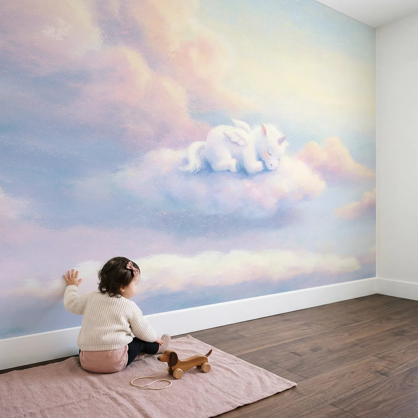 Child in nursery with Baby Pegasus Nap Wallpaper Mural by Whimsy Tots