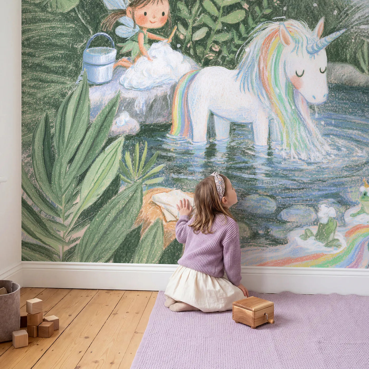 Child in nursery with Washing the Rainbow Mane Wallpaper Mural by Whimsy Tots