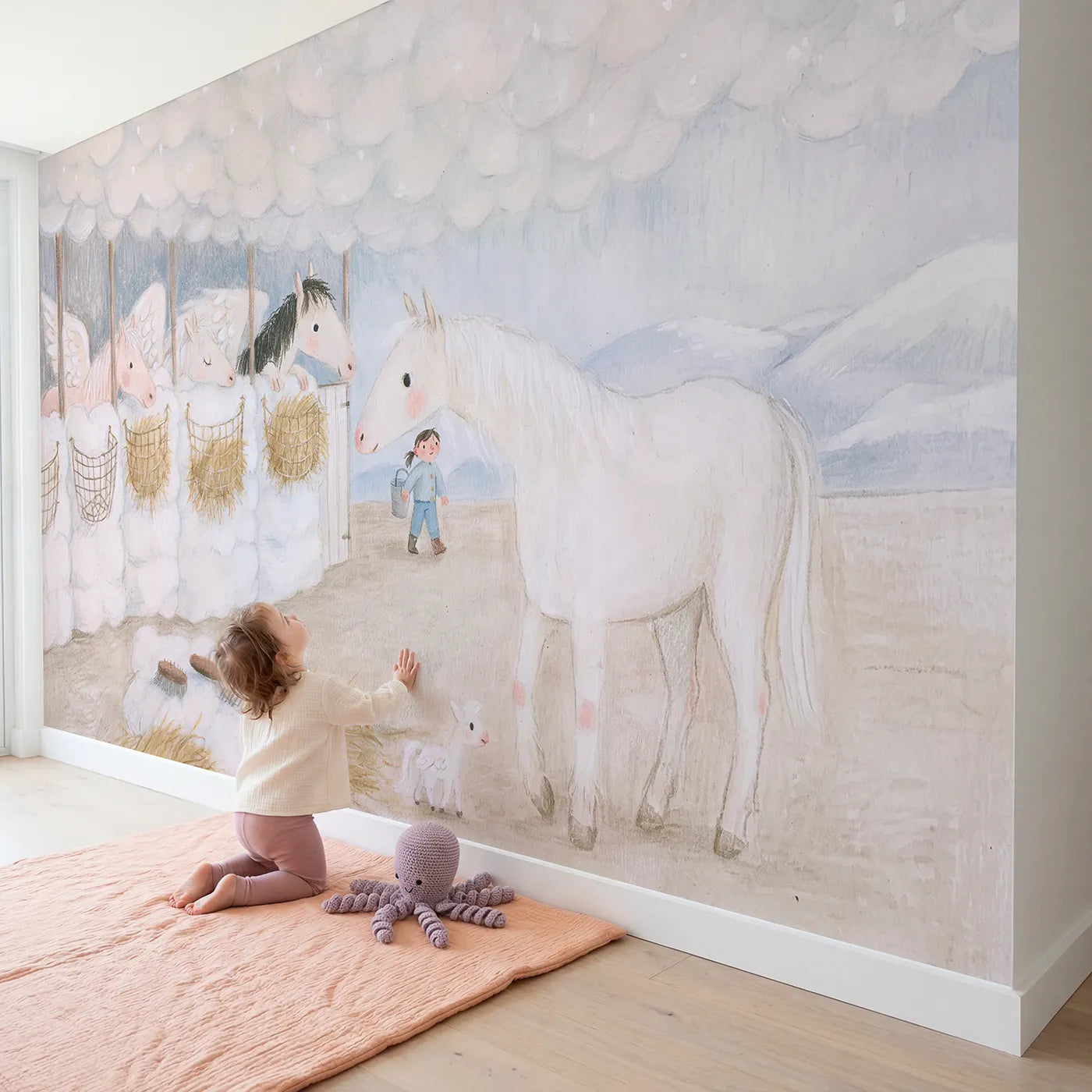 Child in nursery with The Cloud Stables Wallpaper Mural by Whimsy Tots