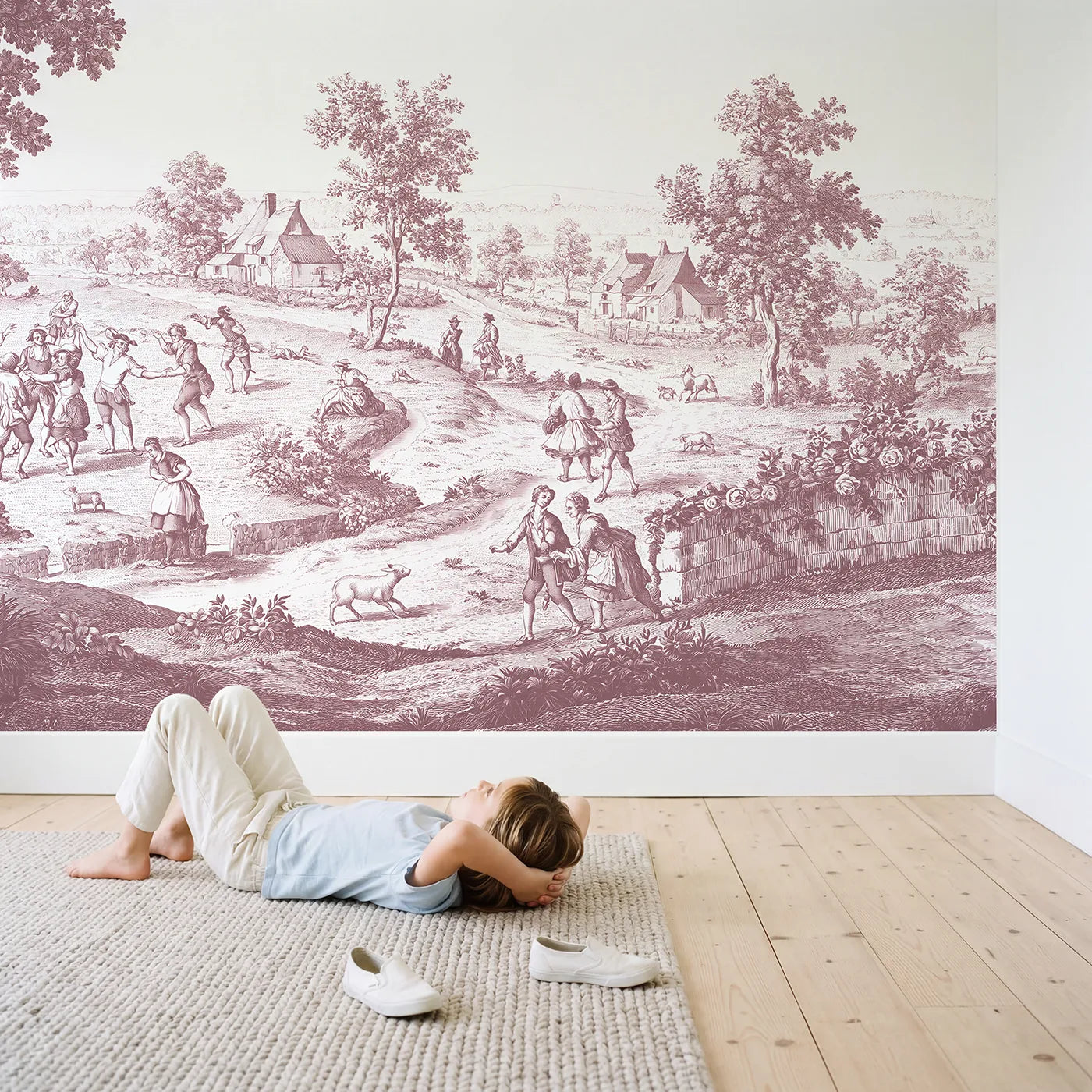 Child in nursery with Village Dance Day Wallpaper Mural in Pink by Whimsy Tots