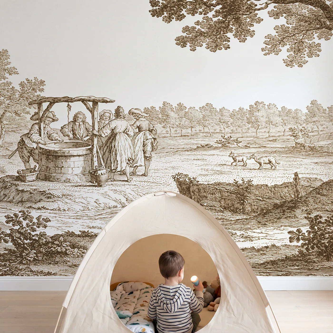 Child in nursery with Village Well Gathering Wallpaper Mural in Brown by Whimsy Tots
