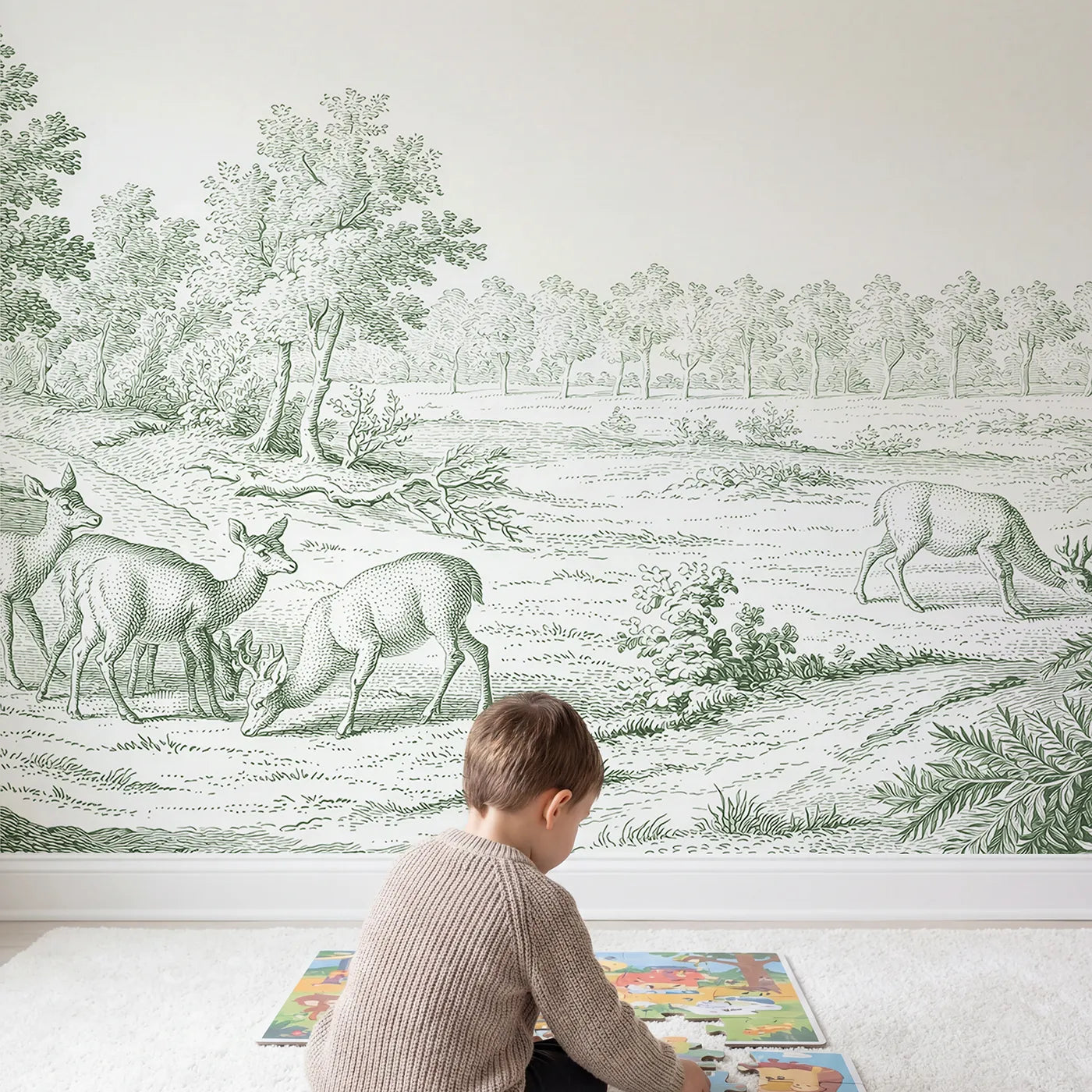 Child in nursery with Grazing Deer Glade Wallpaper Mural in Green by Whimsy Tots