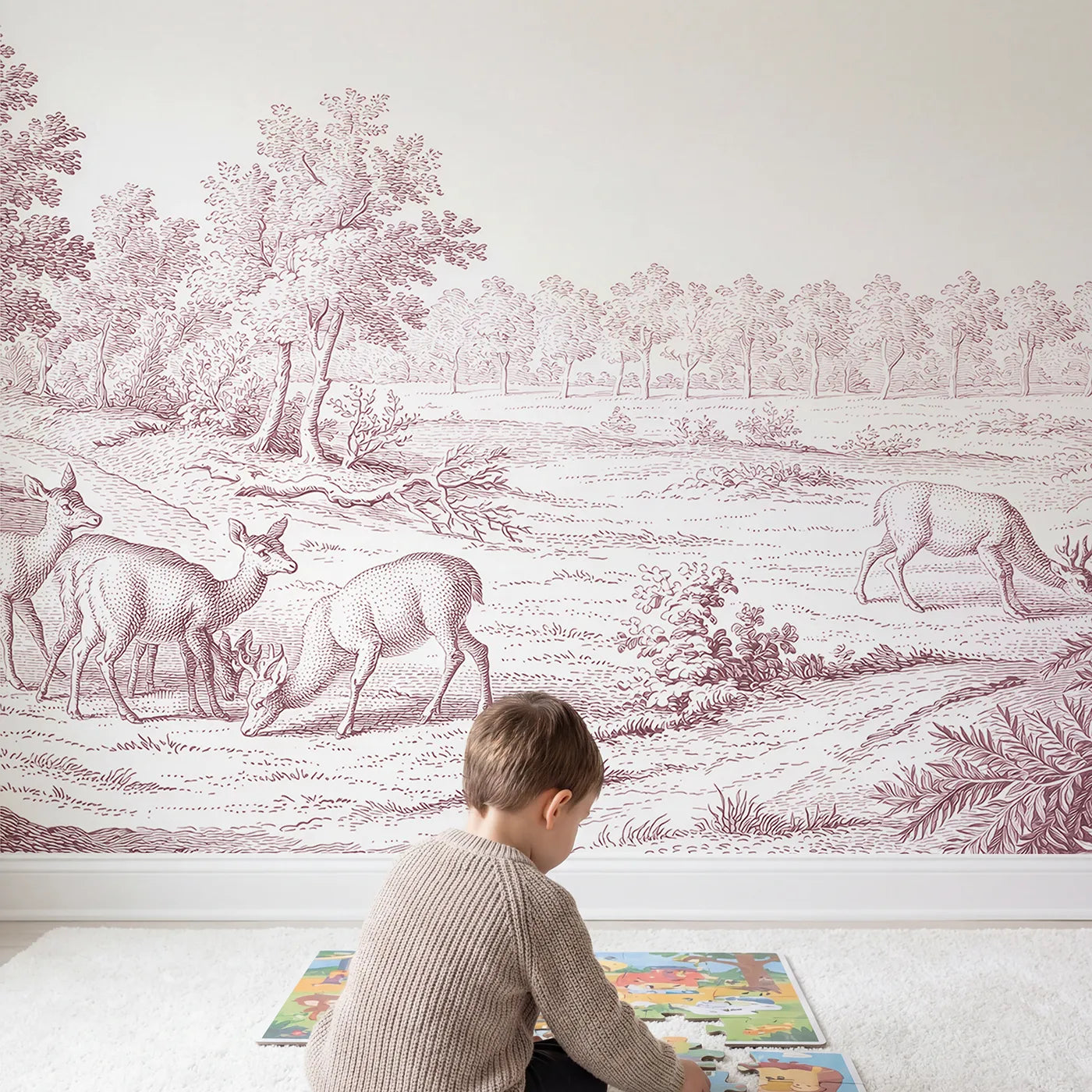 Child in nursery with Grazing Deer Glade Wallpaper Mural in Pink by Whimsy Tots
