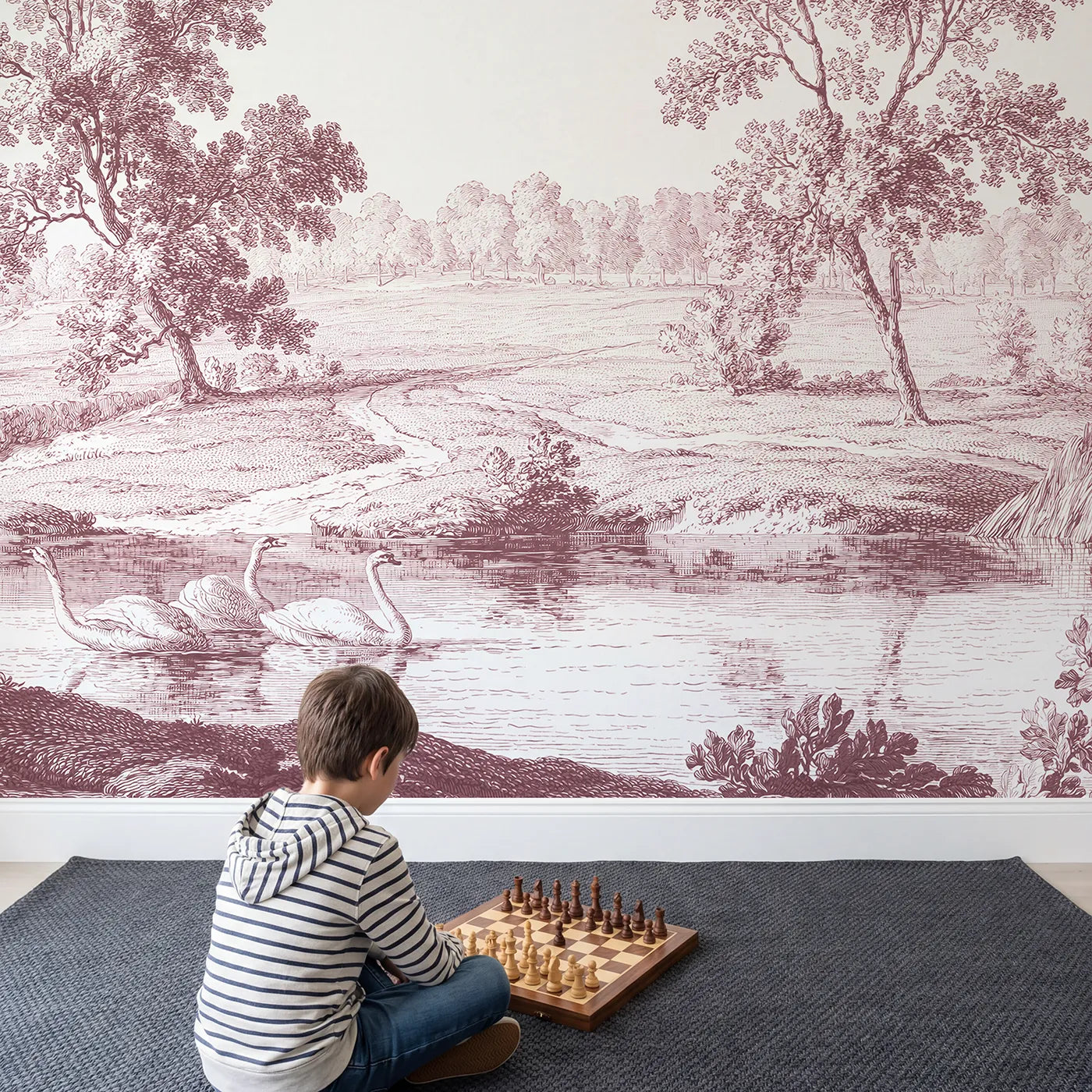 Child in nursery with Gliding Swan Pond Wallpaper Mural in Pink by Whimsy Tots