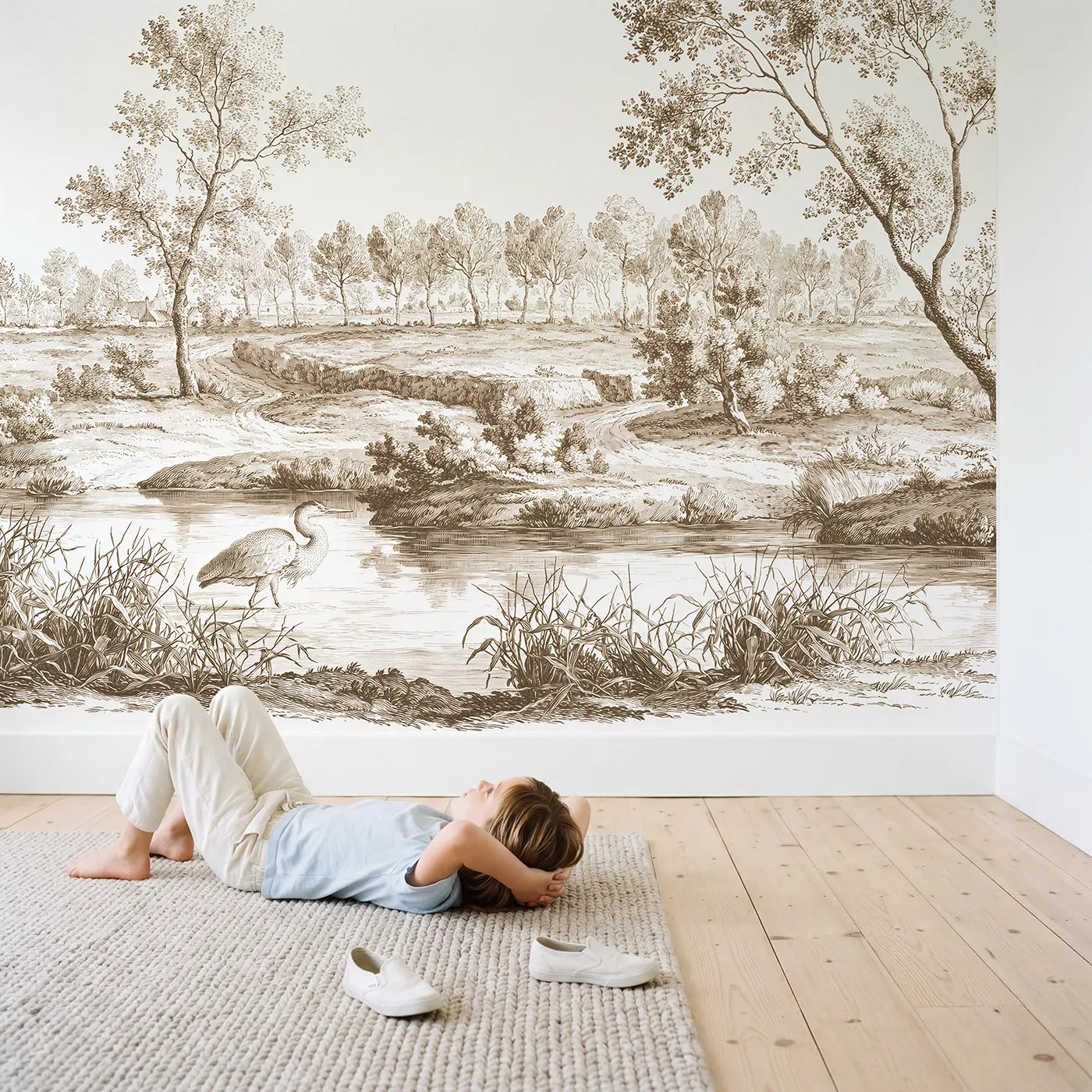 Child in nursery with Heron Marsh Wade Wallpaper Mural in Brown by Whimsy Tots