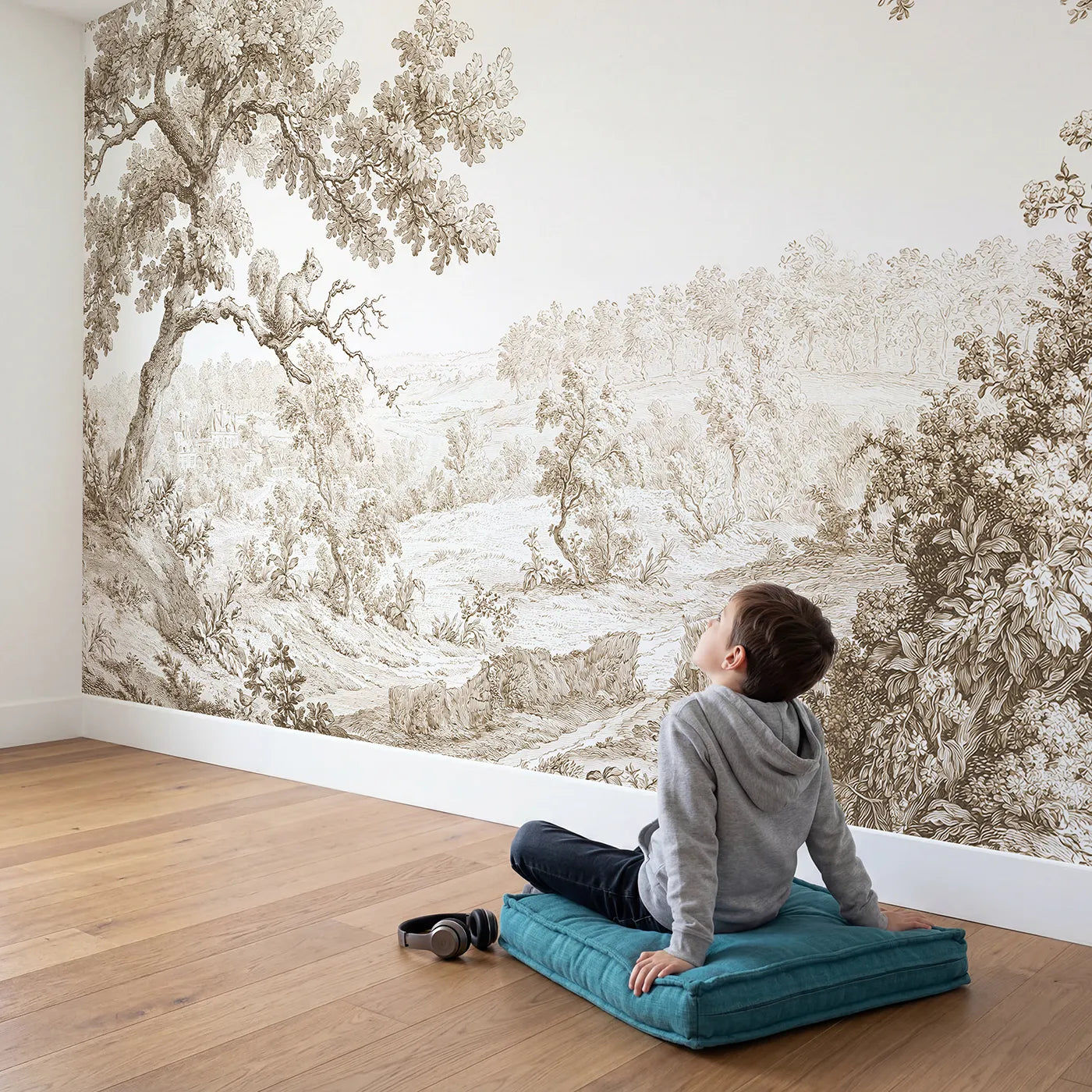 Child in nursery with Squirrel Oak Bough Wallpaper Mural in Brown by Whimsy Tots