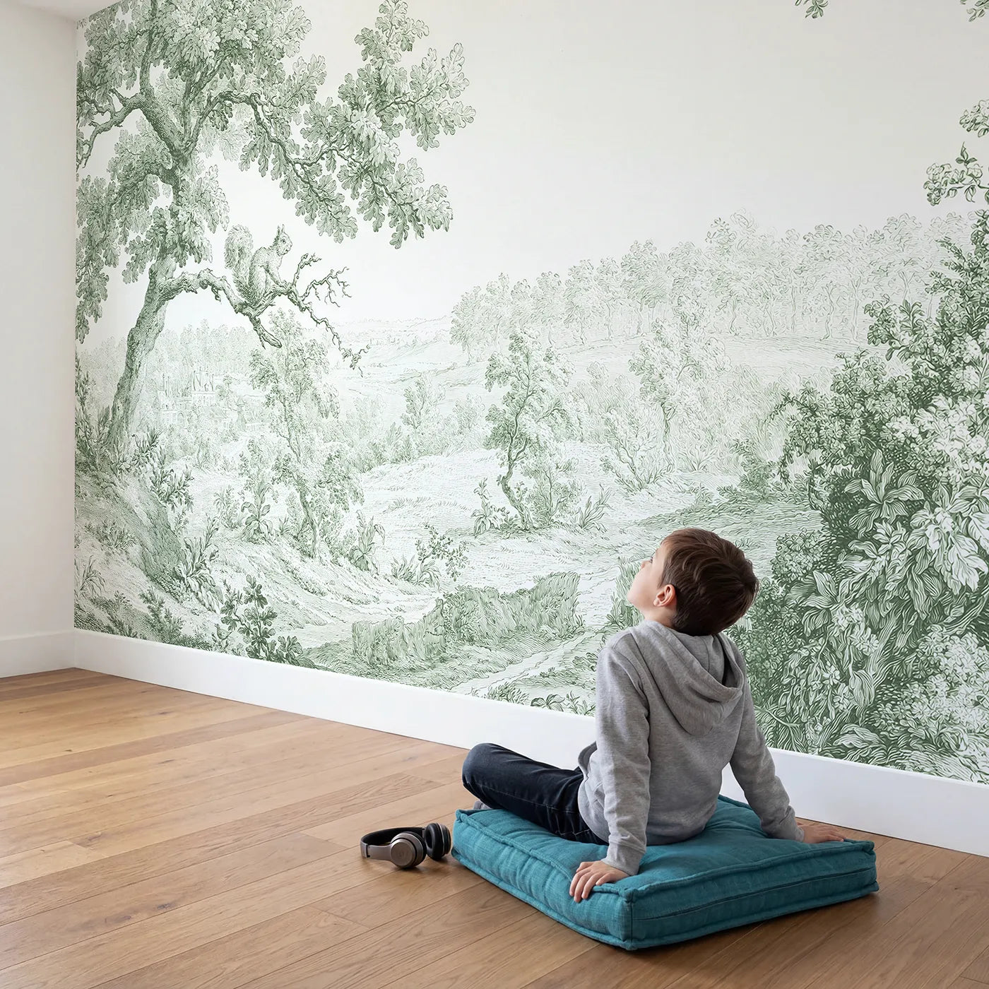Child in nursery with Squirrel Oak Bough Wallpaper Mural in Green by Whimsy Tots