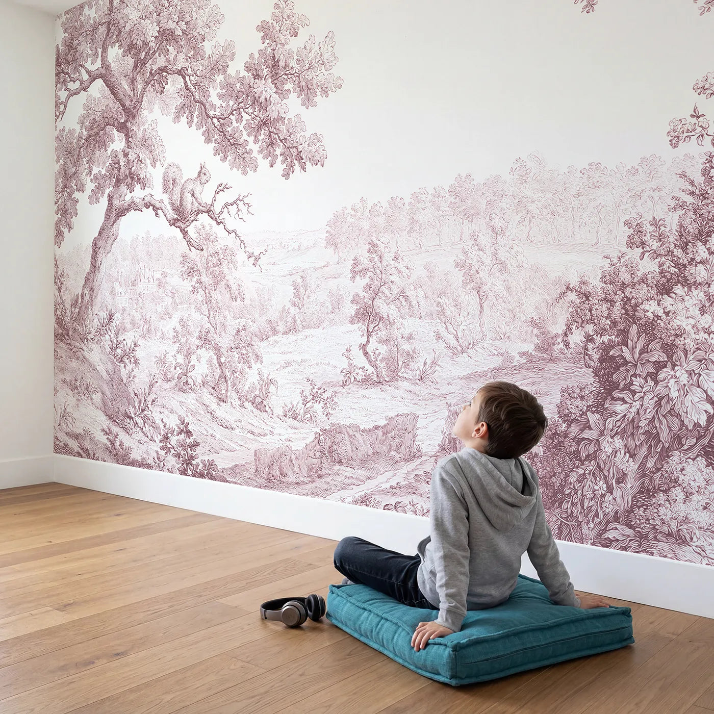 Child in nursery with Squirrel Oak Bough Wallpaper Mural in Pink by Whimsy Tots
