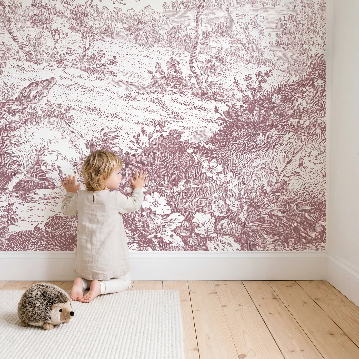 Child in nursery with Hedgerow Hare Pair Wallpaper Mural in Pink by Whimsy Tots