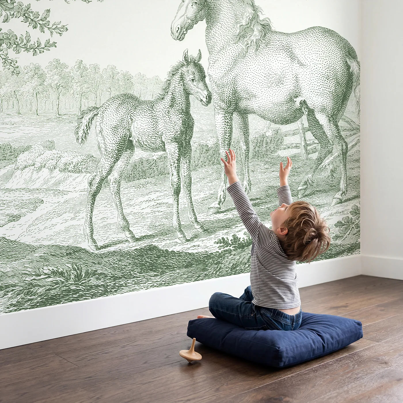 Child in nursery with Foal Spring Meadow Wallpaper Mural in Green by Whimsy Tots