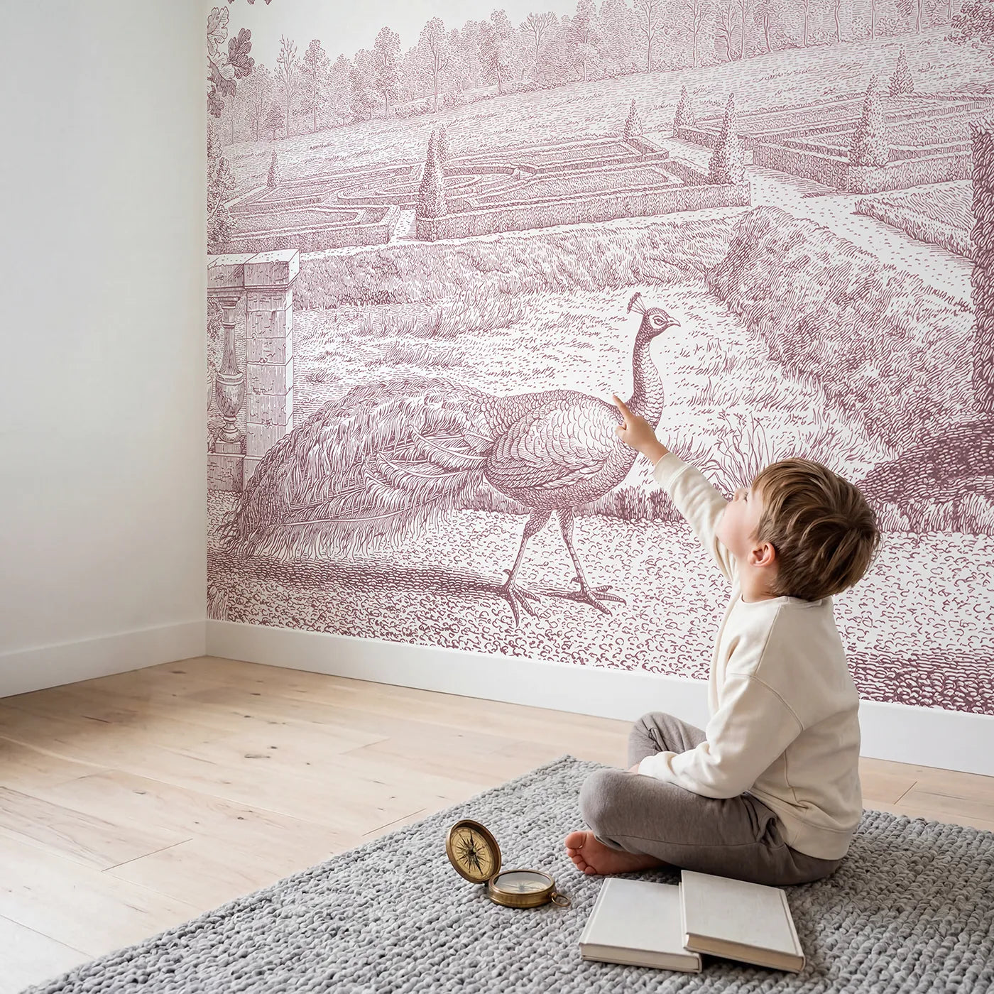 Child in nursery with Peacock Garden Strut Wallpaper Mural in Pink by Whimsy Tots