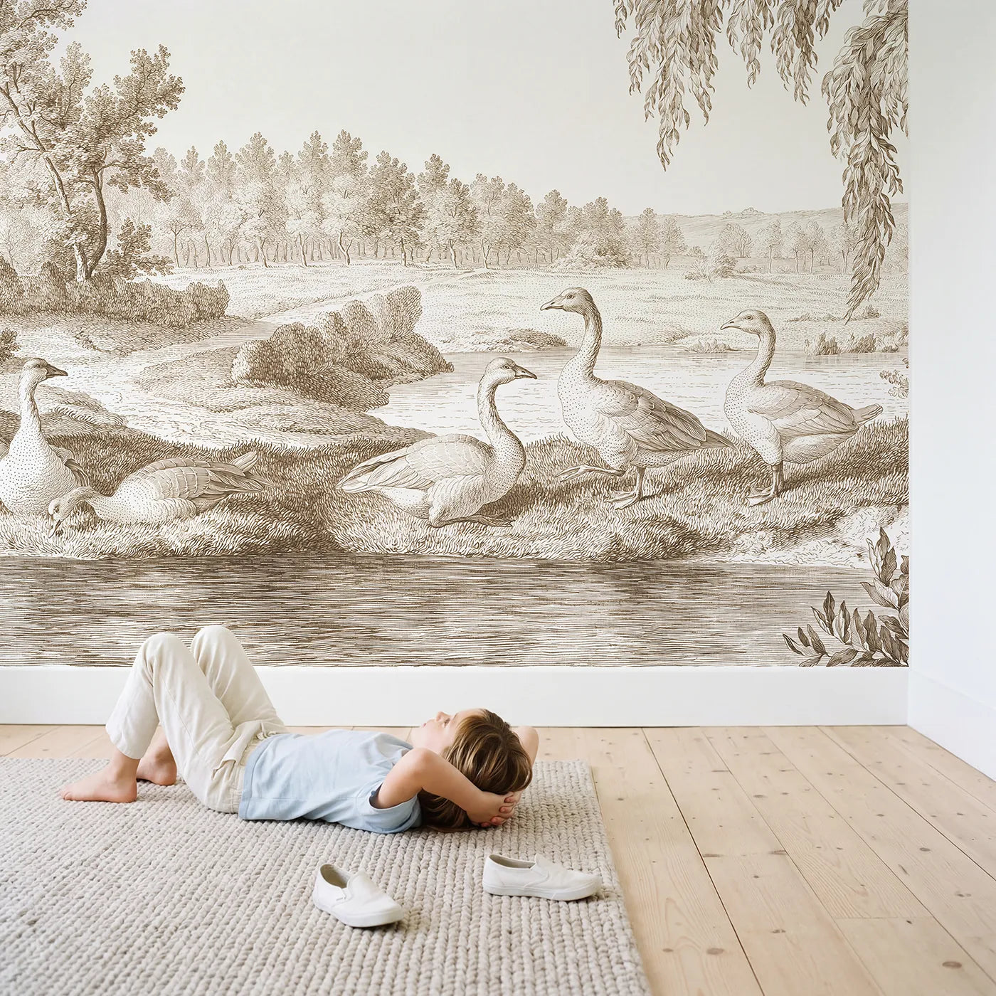 Child in nursery with Goose Pond Morning Wallpaper Mural in Brown by Whimsy Tots