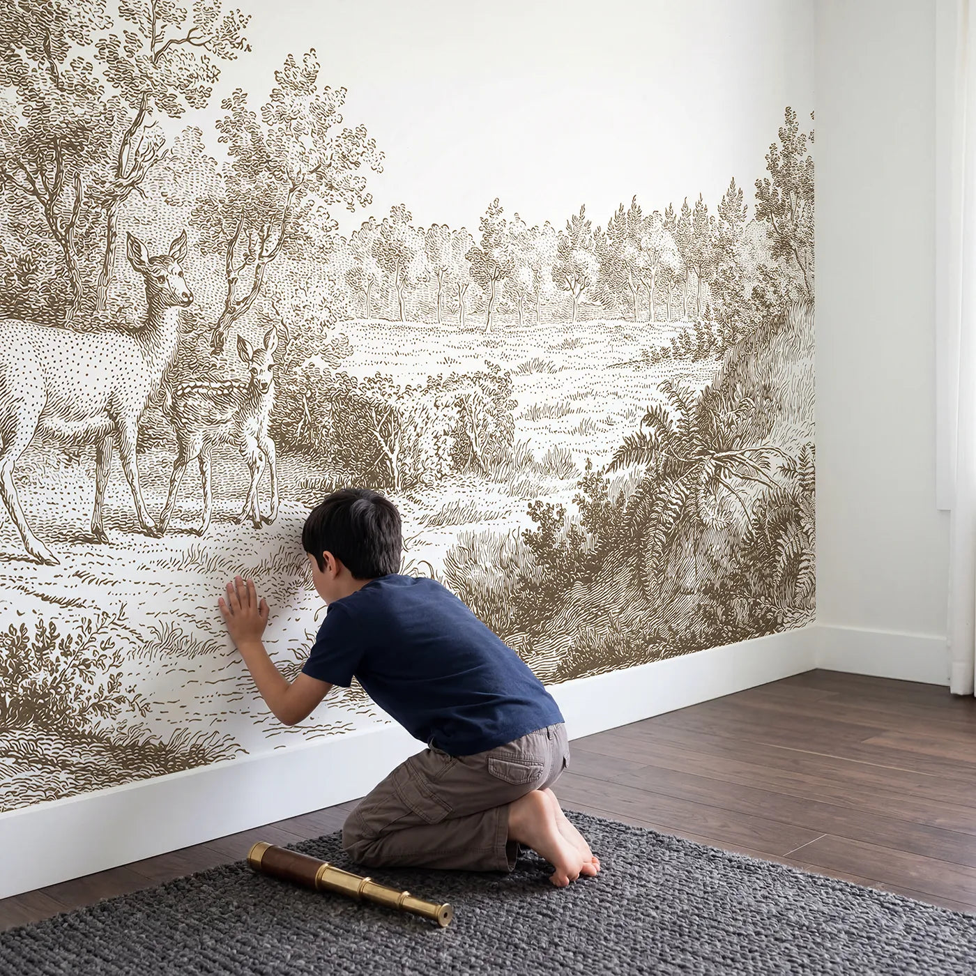 Child in nursery with Doe And Fawn Wallpaper Mural in Brown by Whimsy Tots