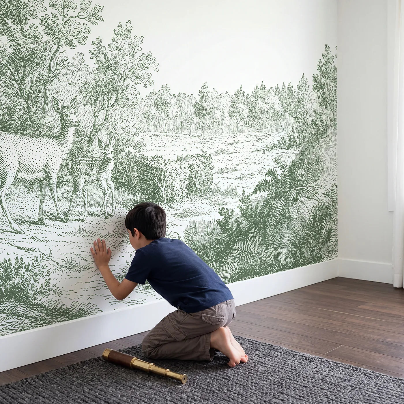 Child in nursery with Doe And Fawn Wallpaper Mural in Green by Whimsy Tots