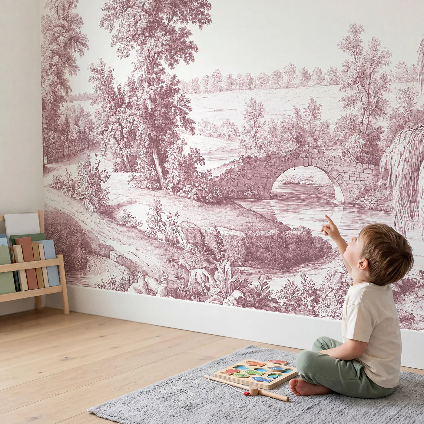Child in nursery with Old Stone Bridge Wallpaper Mural in Pink by Whimsy Tots