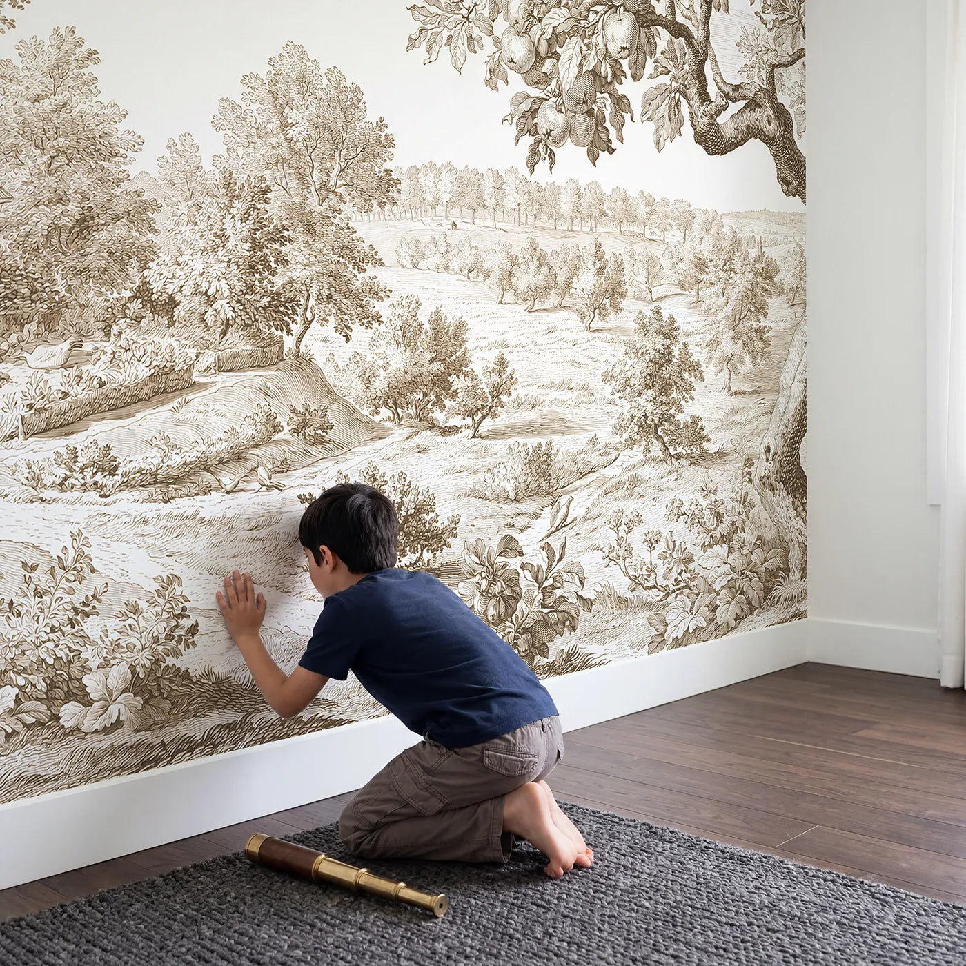 Child in nursery with Dovecote Garden Corner Wallpaper Mural in Brown by Whimsy Tots
