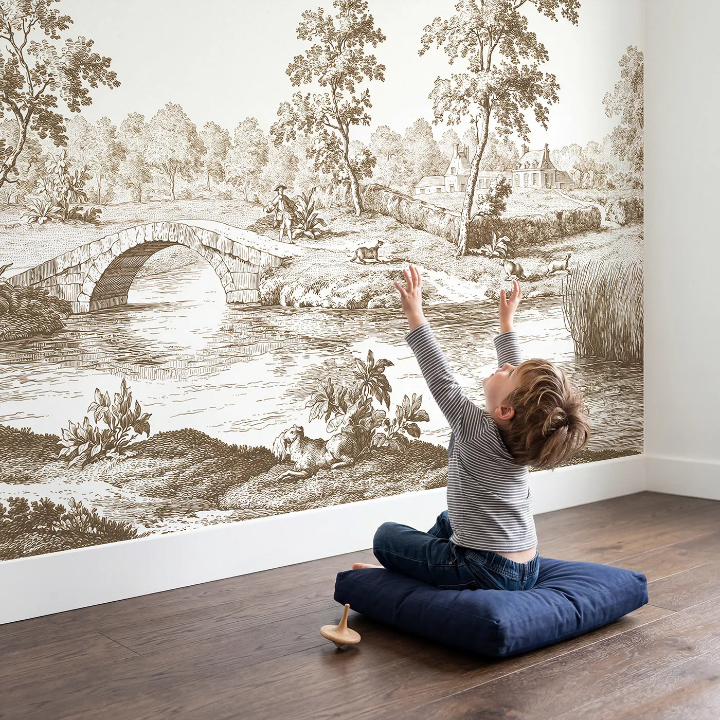 Child in nursery with Stone Arch Bridge Wallpaper Mural in Brown by Whimsy Tots