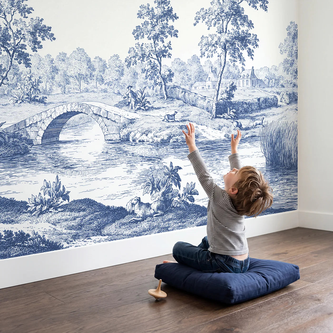 Child in nursery with Stone Arch Bridge Wallpaper Mural by Whimsy Tots