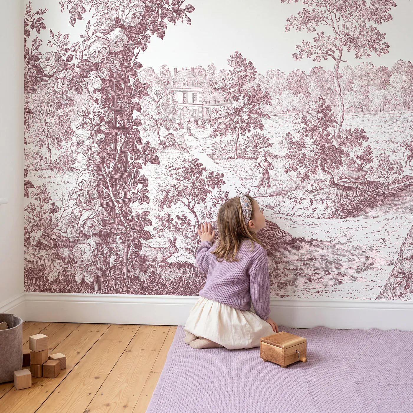 Child in nursery with Trellis Rose Arbor Wallpaper Mural in Pink by Whimsy Tots