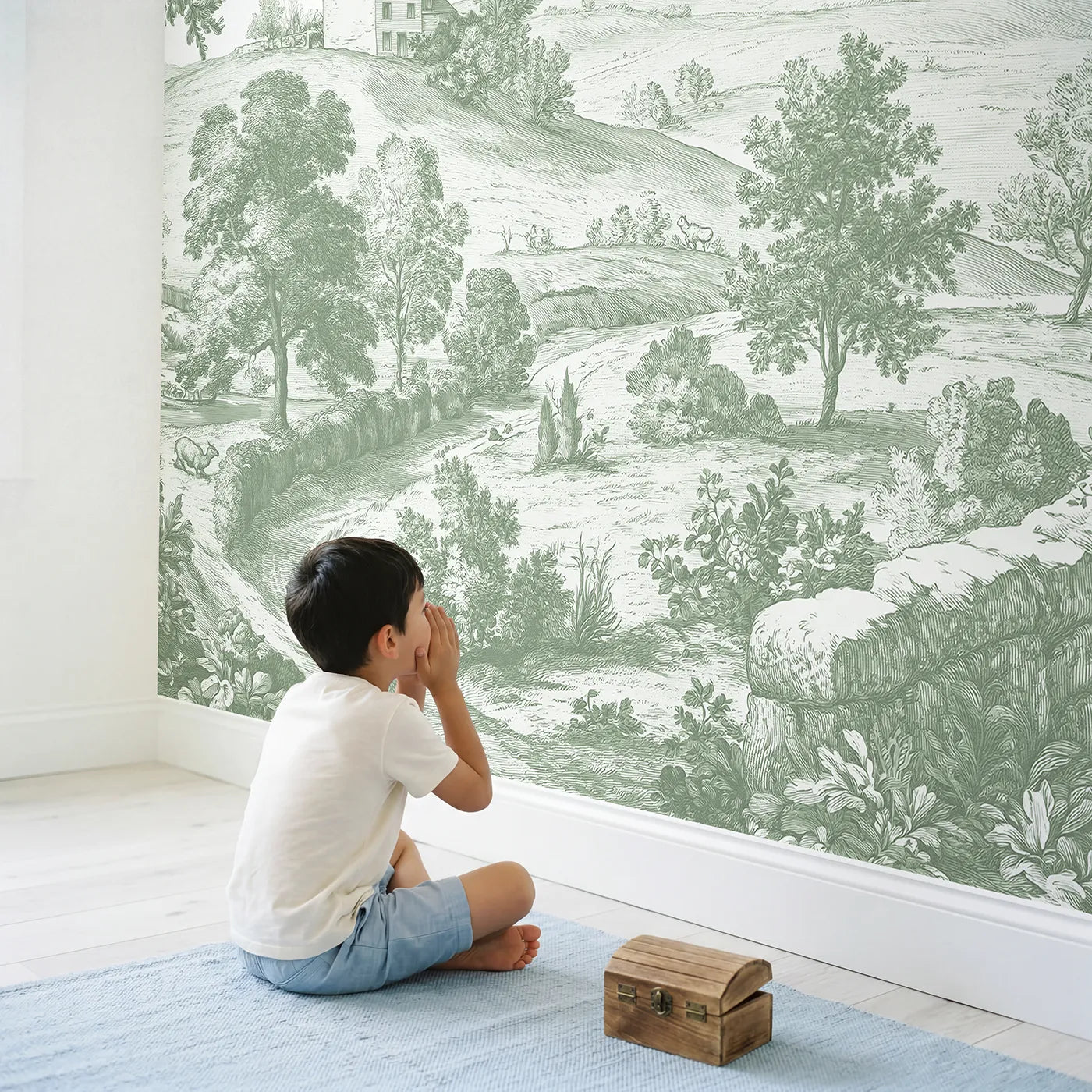 Child in nursery with Hilltop Cottage View Wallpaper Mural in Green by Whimsy Tots
