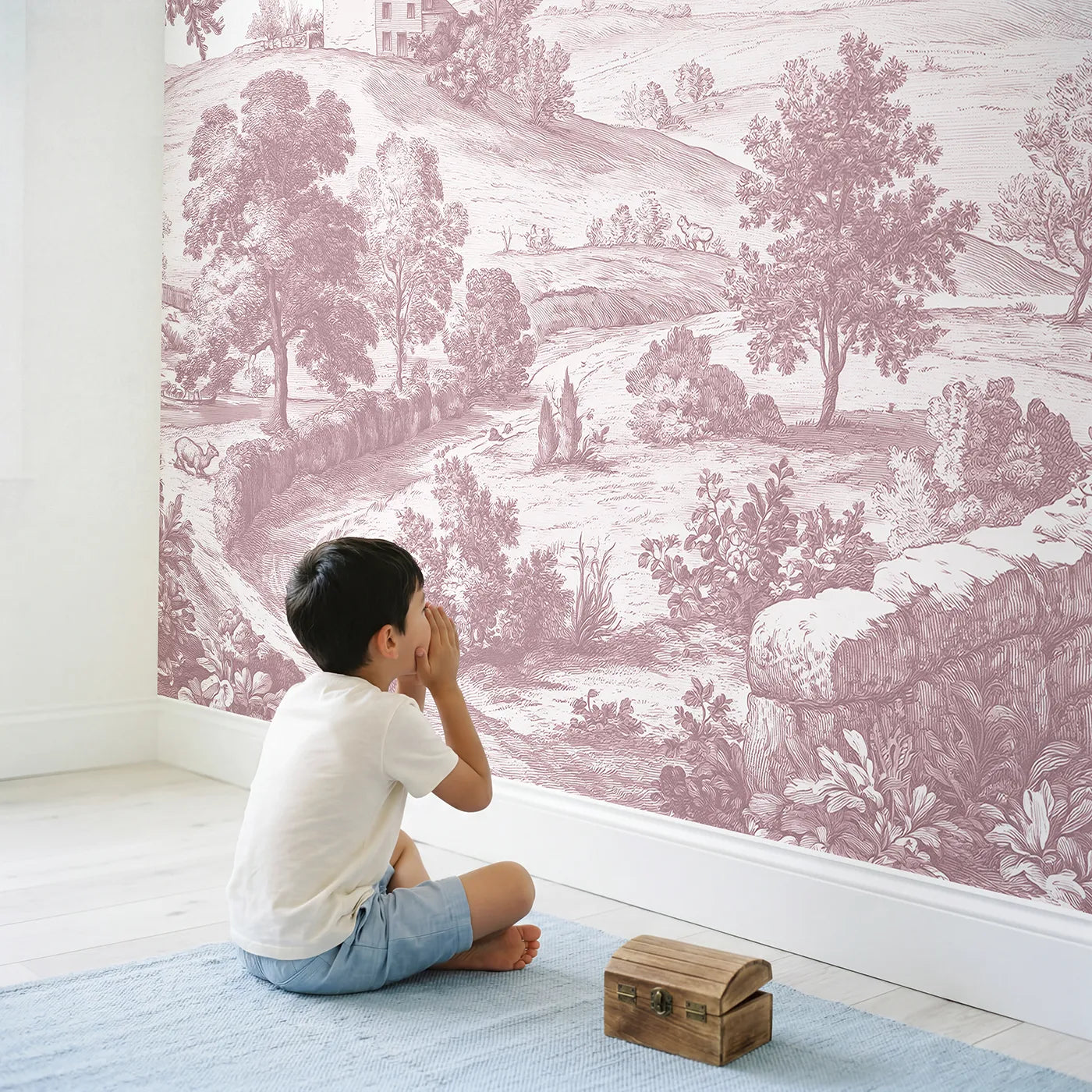 Child in nursery with Hilltop Cottage View Wallpaper Mural in Pink by Whimsy Tots