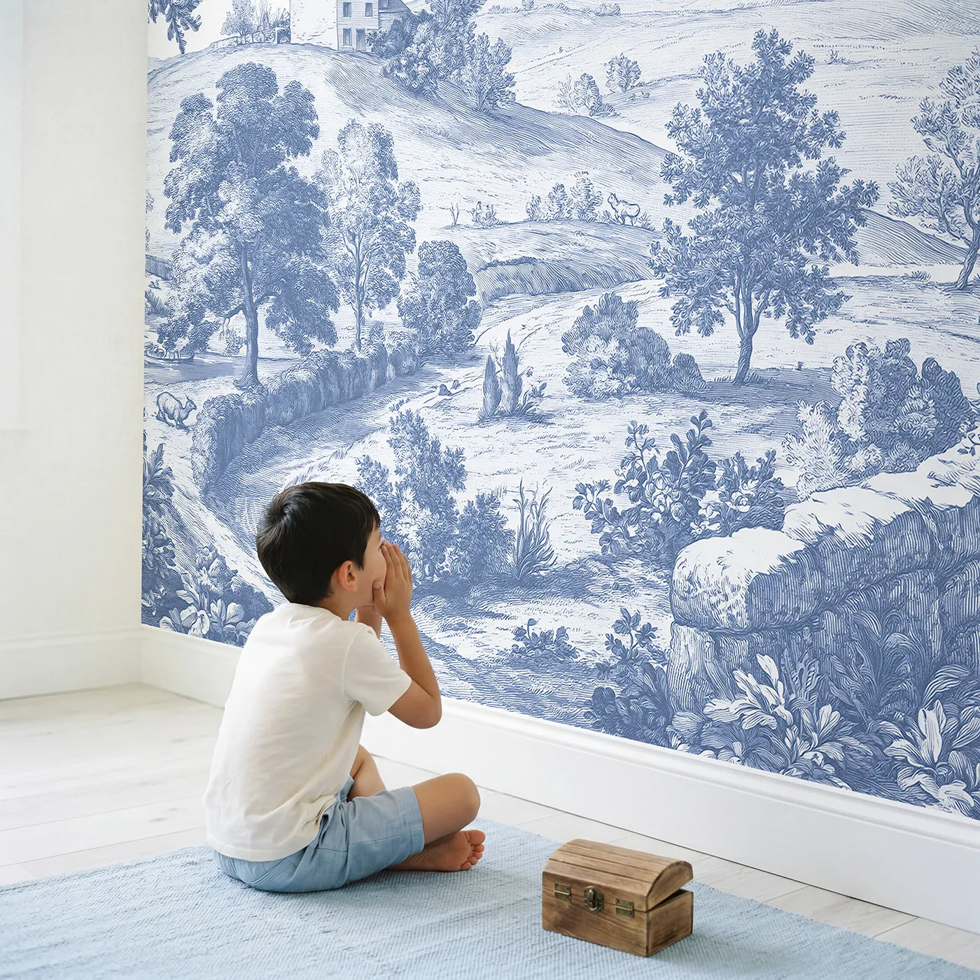 Child in nursery with Hilltop Cottage View Wallpaper Mural by Whimsy Tots