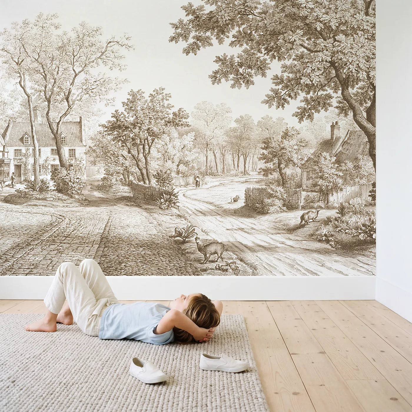 Child in nursery with Cobblestone Village Square Wallpaper Mural in Brown by Whimsy Tots