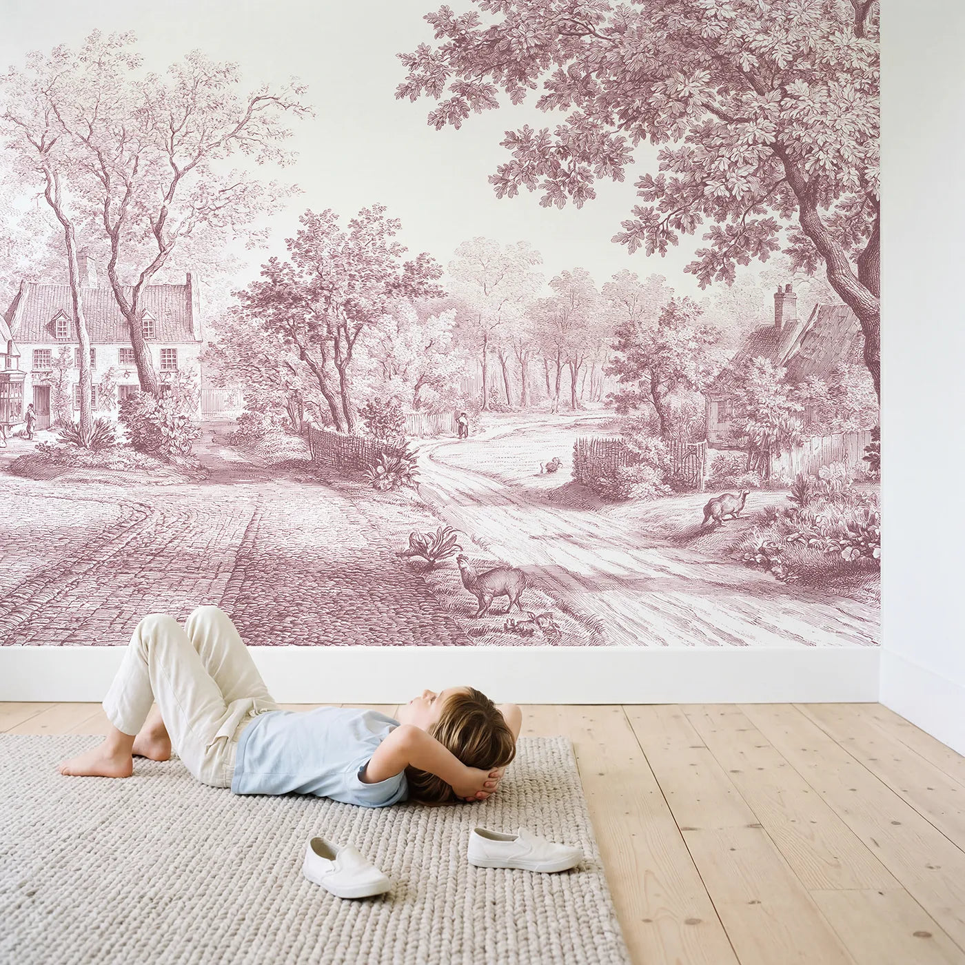 Child in nursery with Cobblestone Village Square Wallpaper Mural in Pink by Whimsy Tots