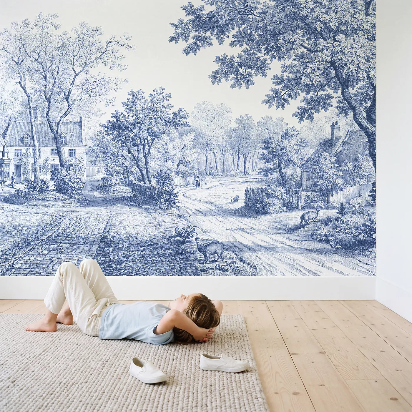 Child in nursery with Cobblestone Village Square Wallpaper Mural by Whimsy Tots