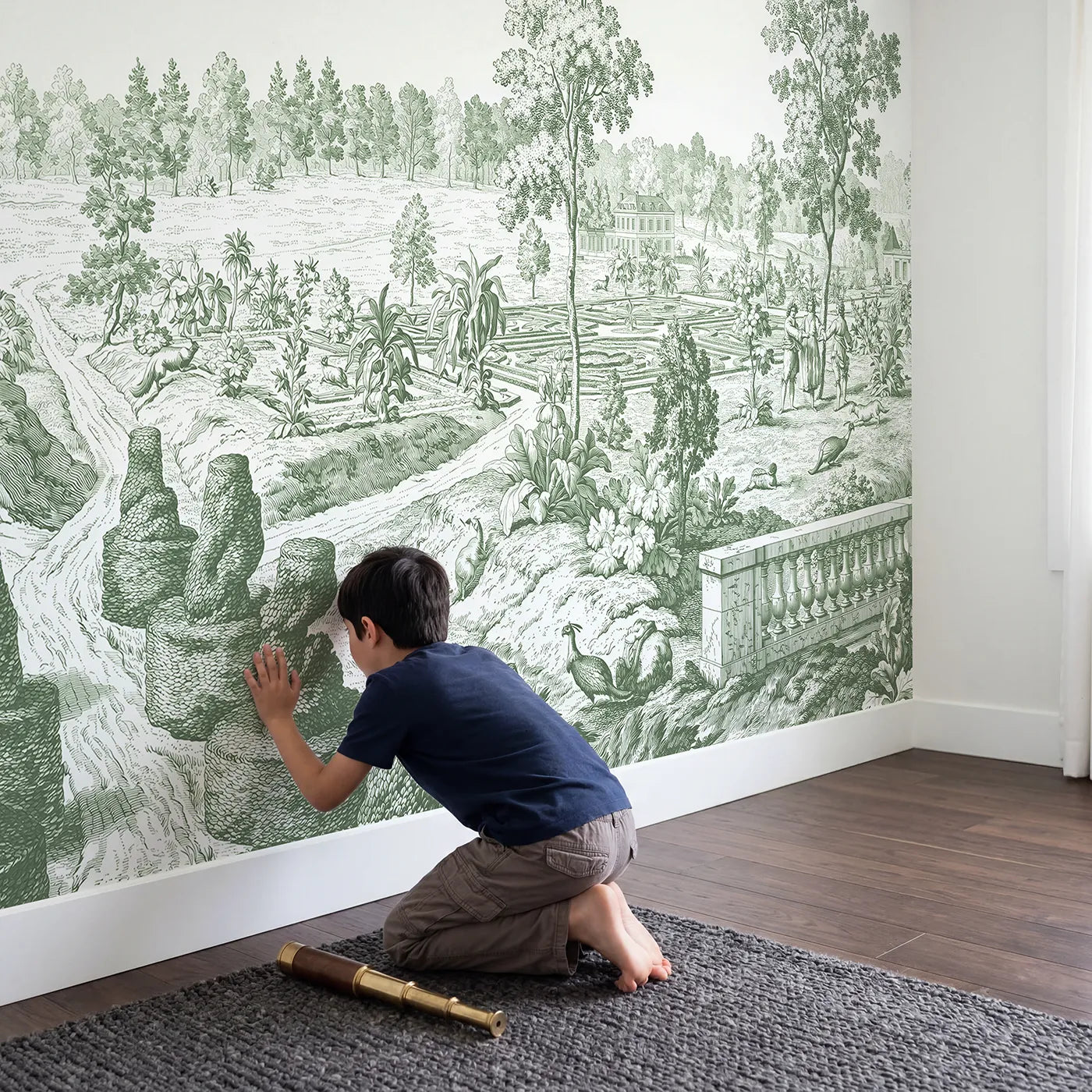 Child in nursery with Topiary Garden Path Wallpaper Mural in Green by Whimsy Tots