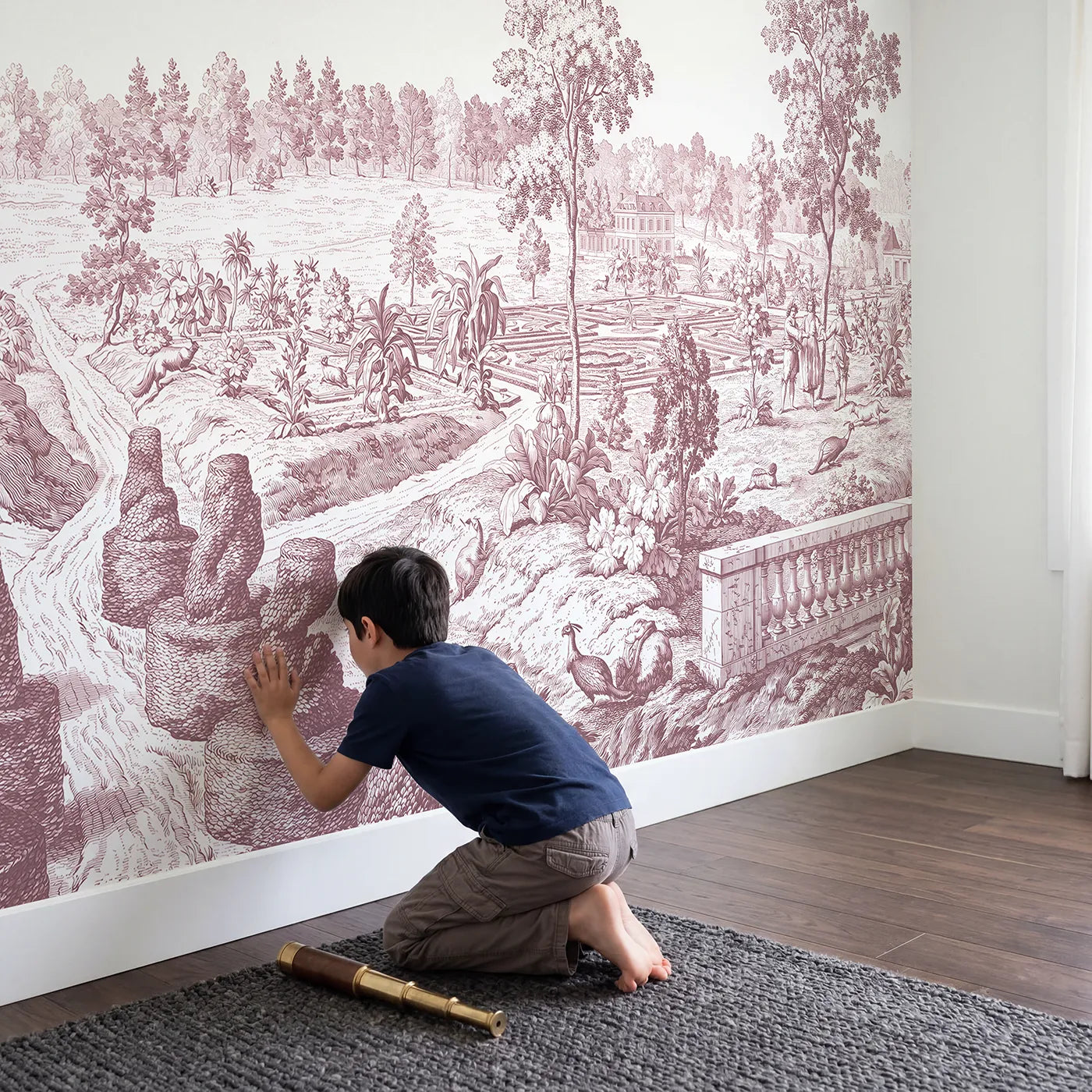 Child in nursery with Topiary Garden Path Wallpaper Mural in Pink by Whimsy Tots