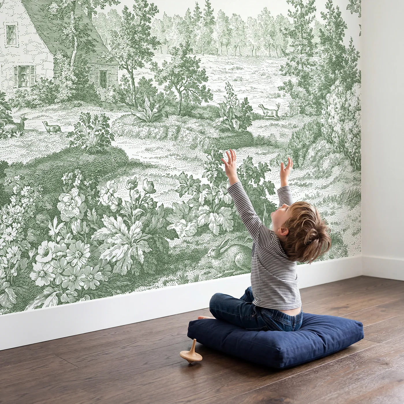 Child in nursery with Snug Cottage Garden Wallpaper Mural in Green by Whimsy Tots