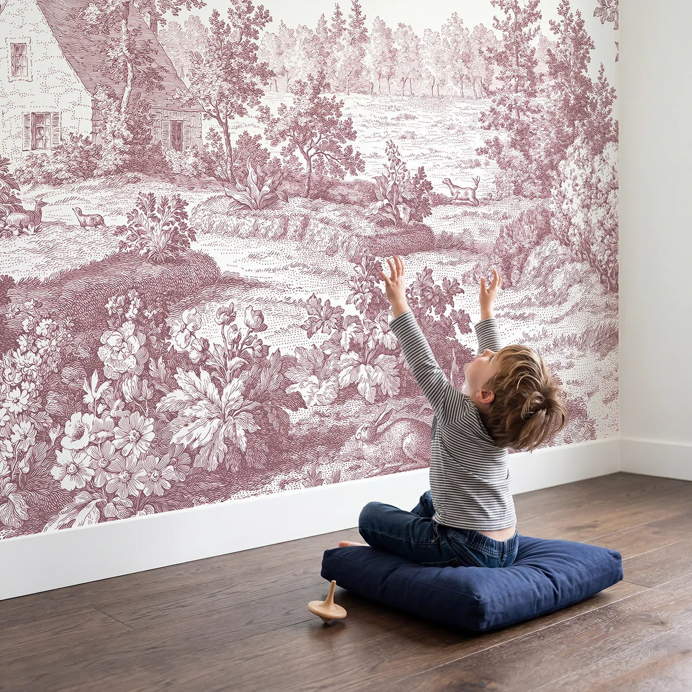 Child in nursery with Snug Cottage Garden Wallpaper Mural in Pink by Whimsy Tots