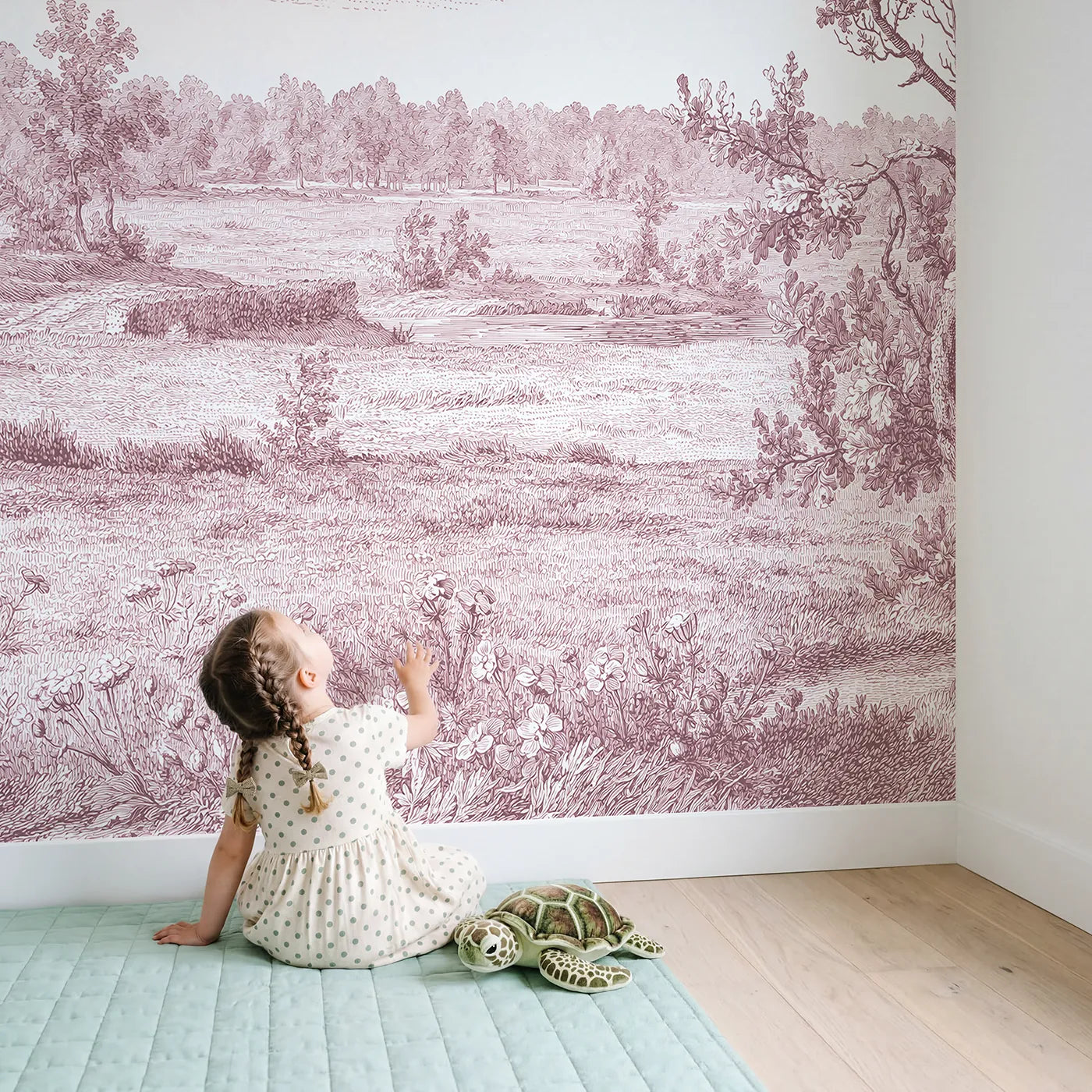 Child in nursery with Wildflower Field Drift Wallpaper Mural in Pink by Whimsy Tots