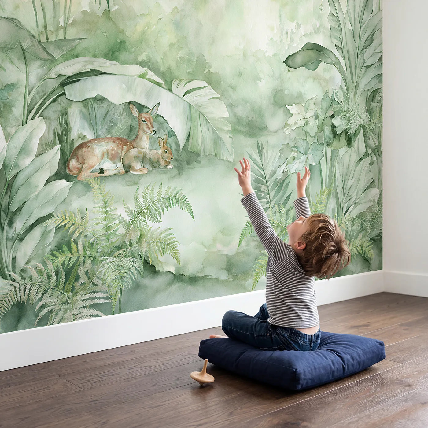 Child in nursery with Misty Eden Morning Wallpaper Mural by Whimsy Tots