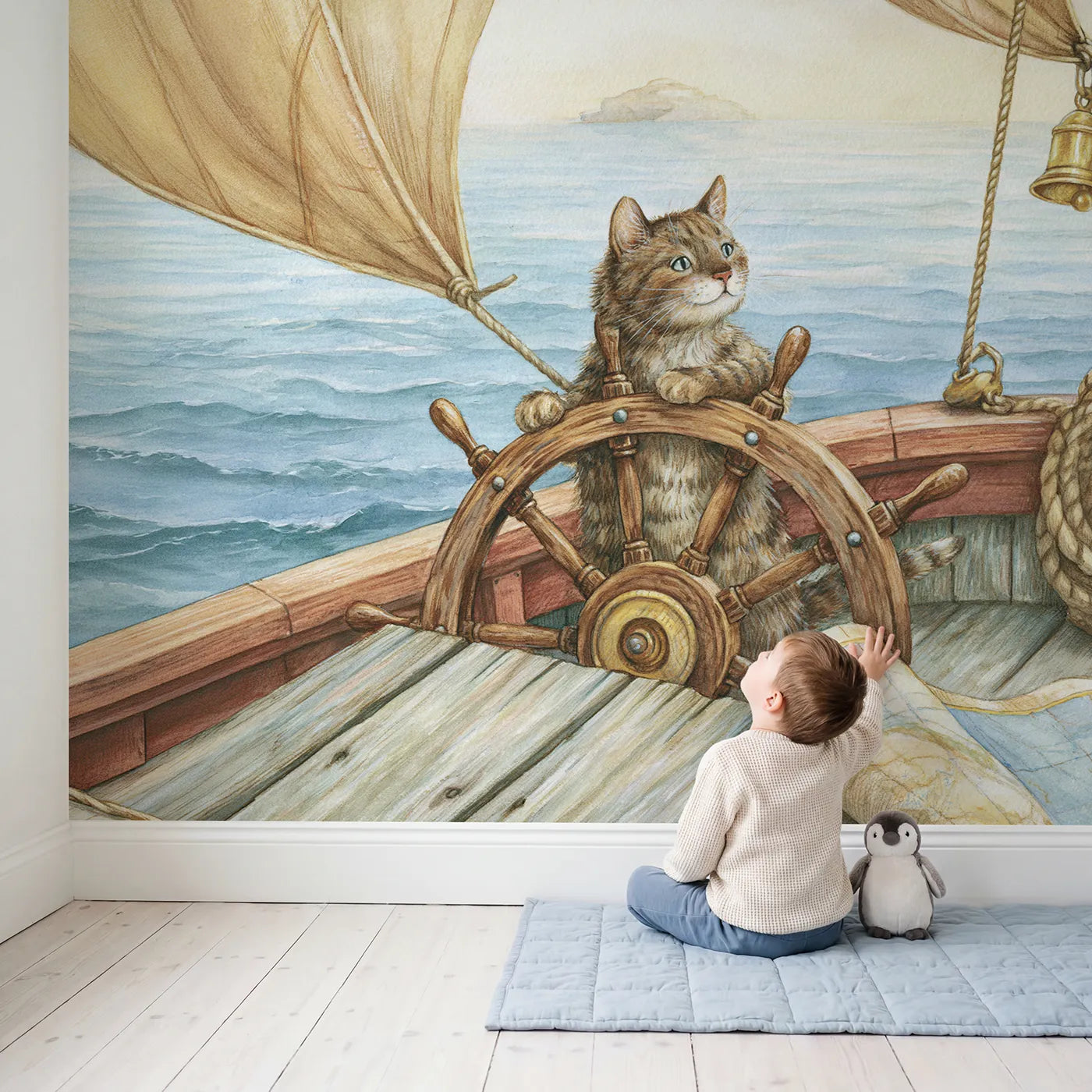 Child in nursery with Jolly Cat Captain Wallpaper Mural by Whimsy Tots
