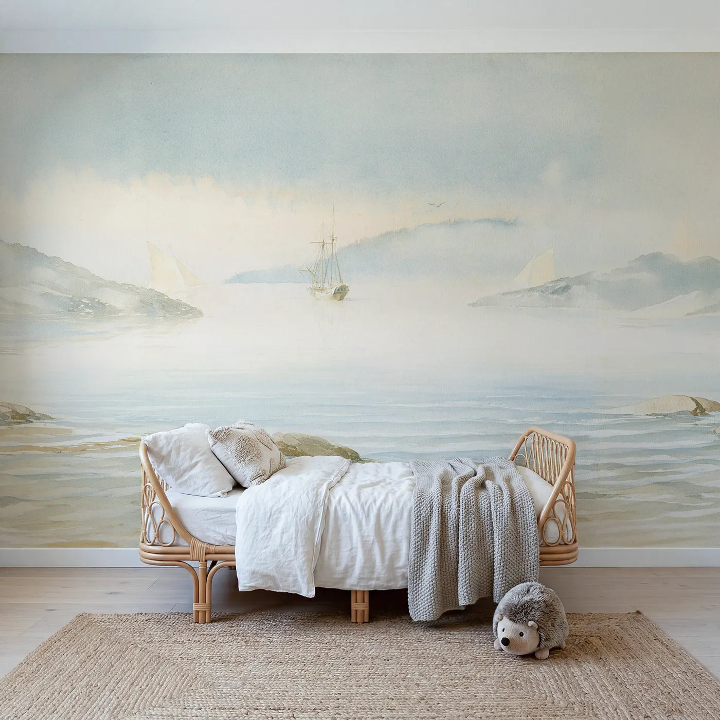 Watercolor wall mural of a ship anchored in a misty cove on cool cream by Whimsy Tots