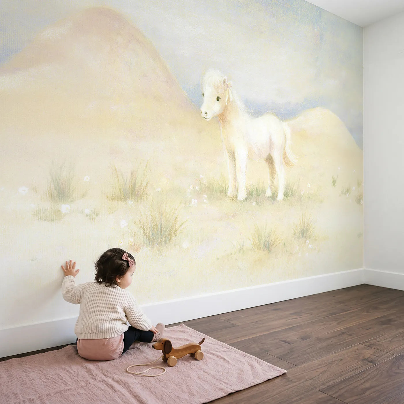 Child in nursery with Tiny Circus Pony Wallpaper Mural by Whimsy Tots