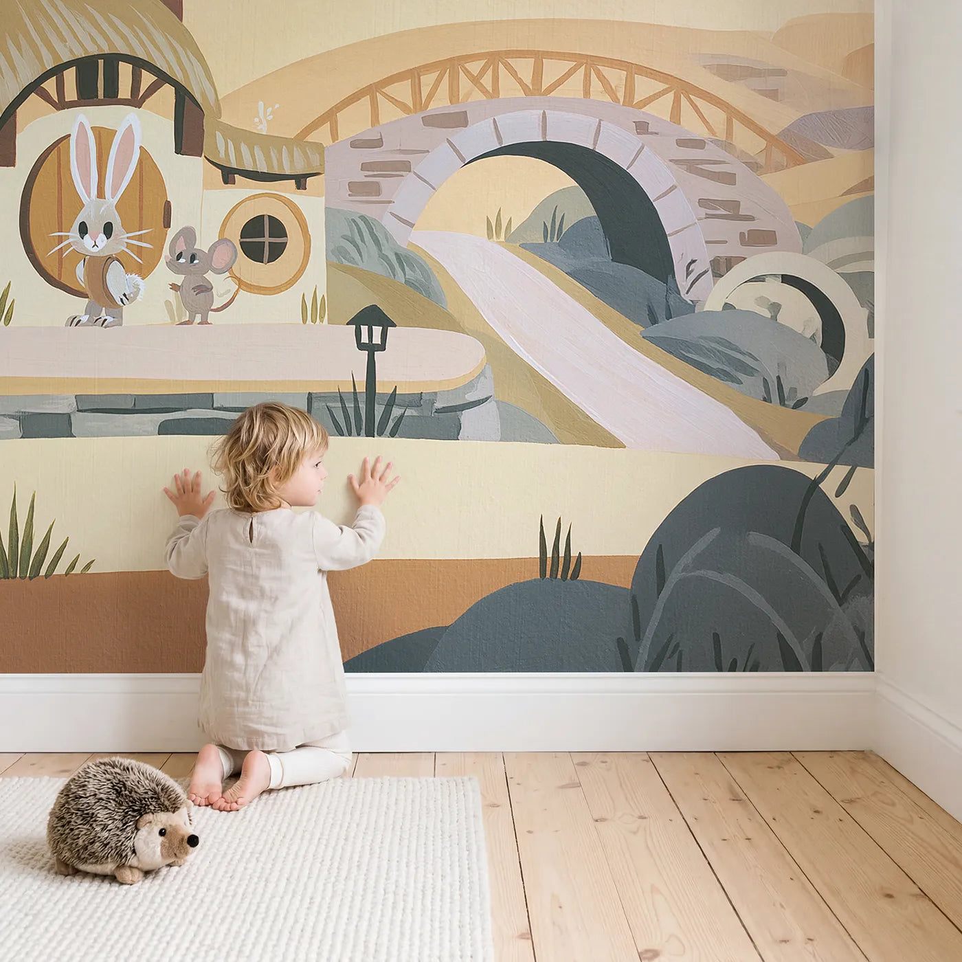 Child in nursery with Folk Animal Village Wallpaper Mural by Whimsy Tots