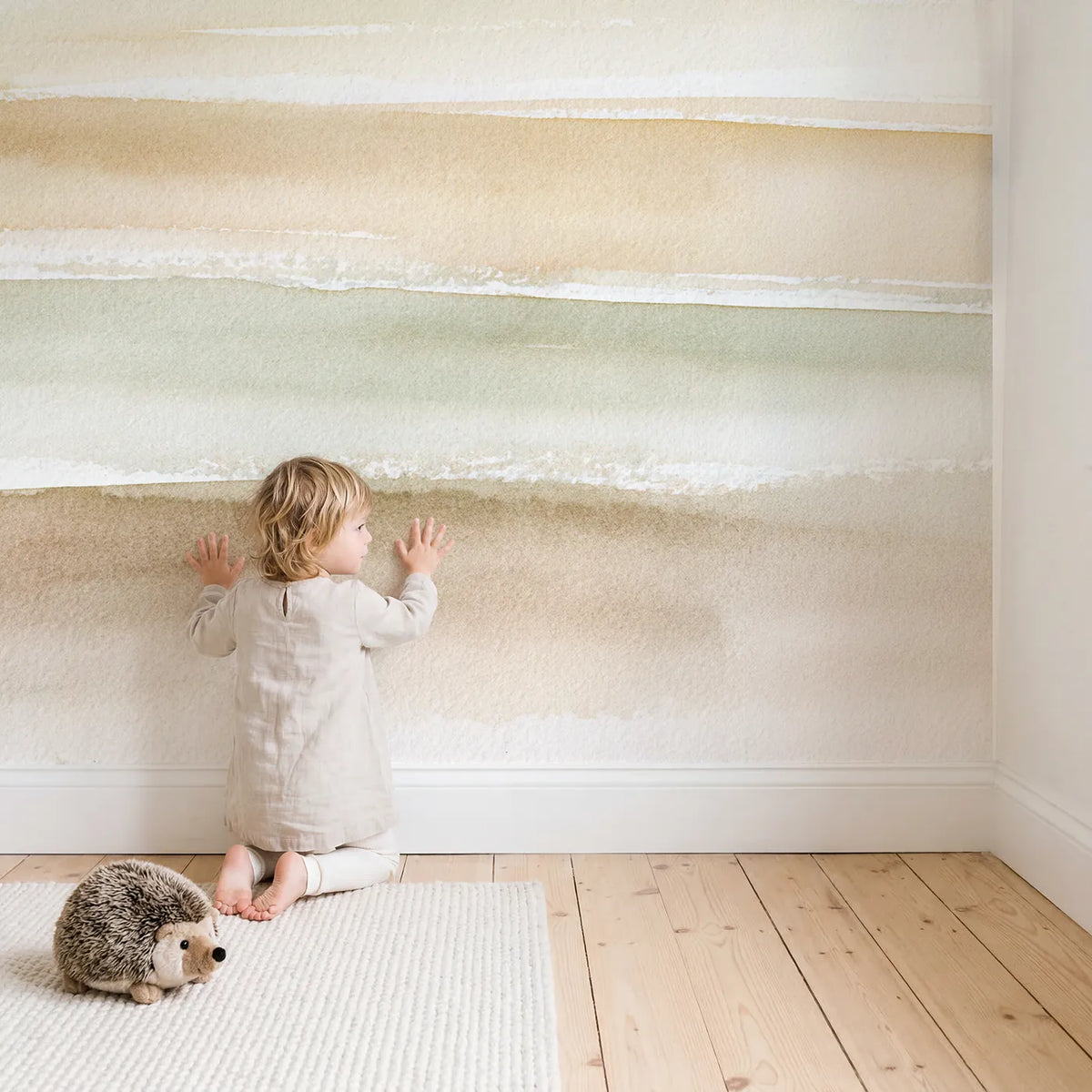 Child in nursery with Sanded Horizon Wallpaper Mural by Whimsy Tots
