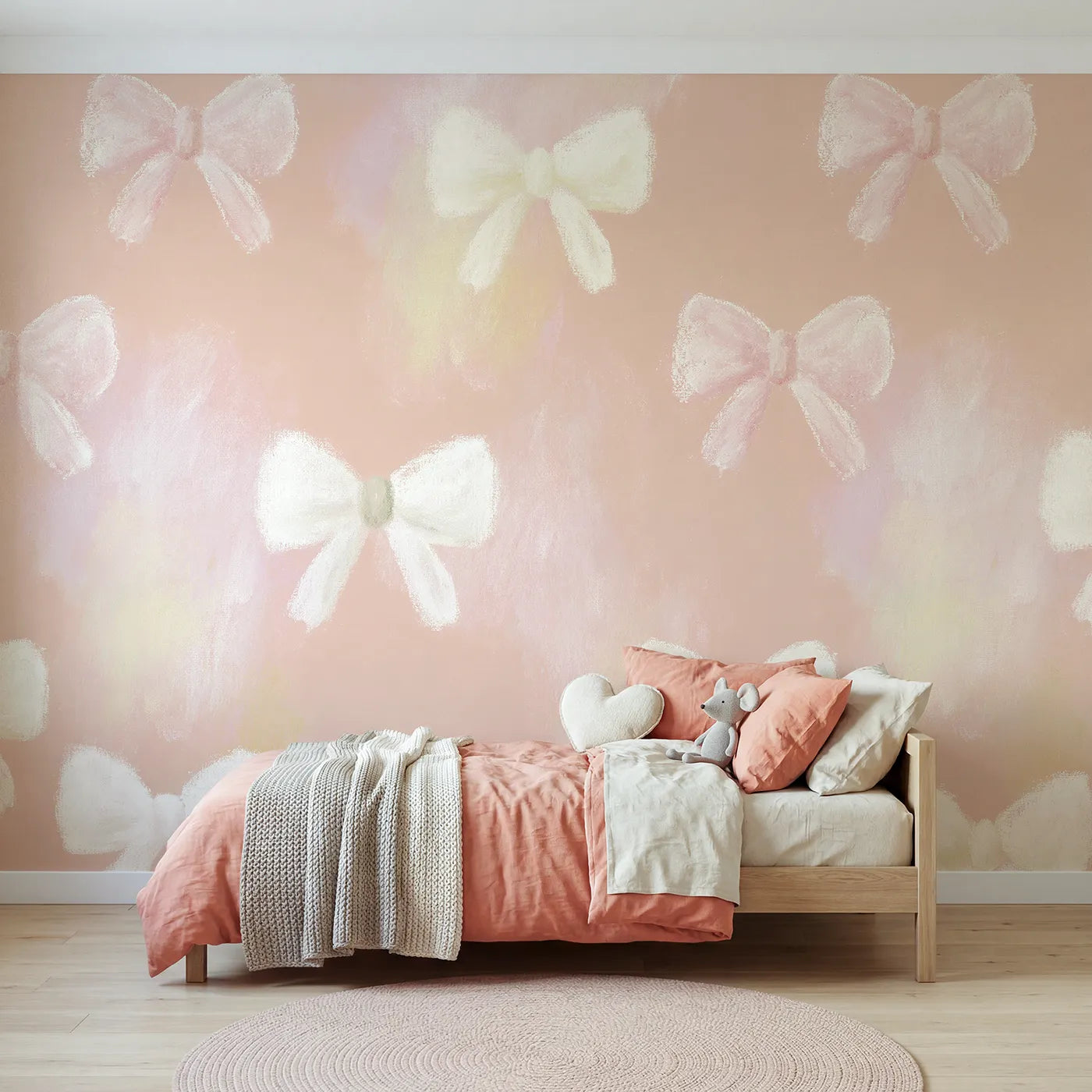 Chalk pastel wall mural of scattered bows on soft blush by Whimsy Tots