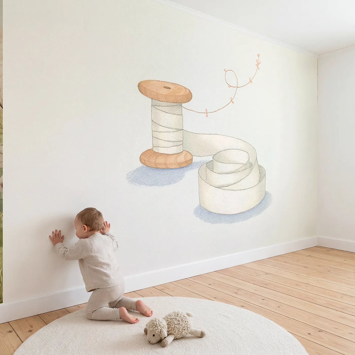 Child in nursery with The Ribbon Spool Wallpaper Mural by Whimsy Tots